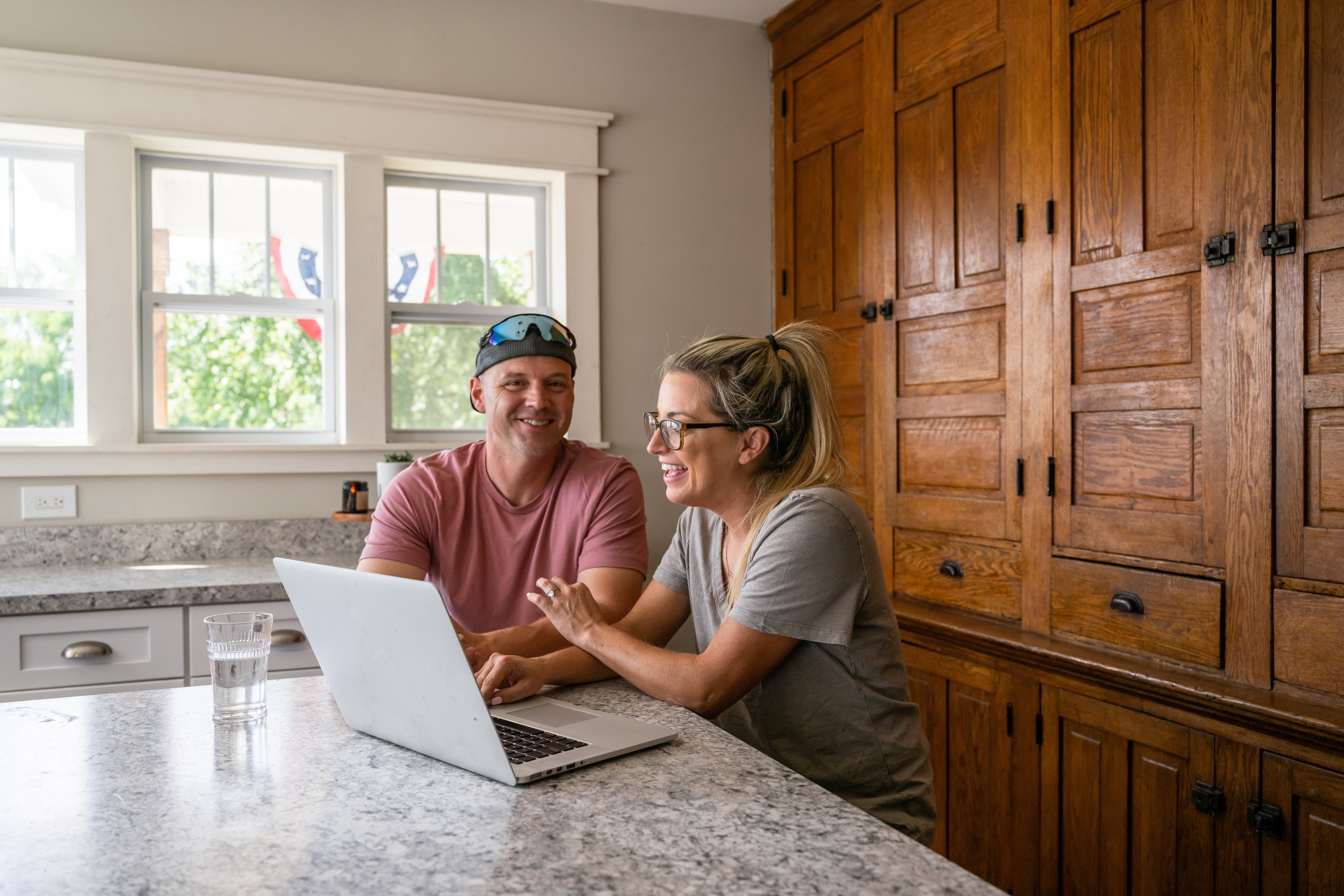 Marine veteran at home with family on a early morning in the kitchen.